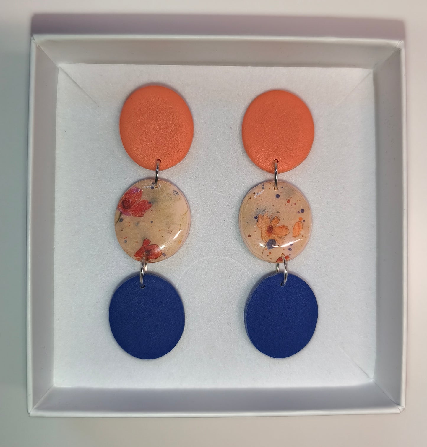 Disco floral naranja-azul