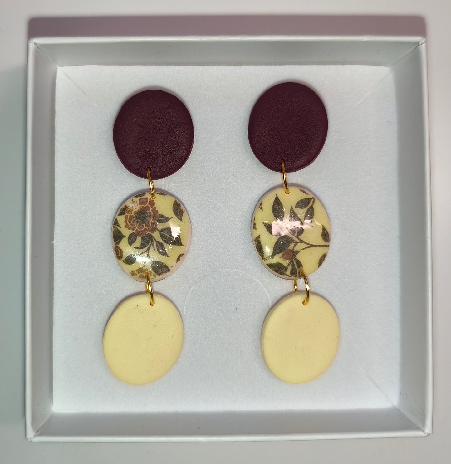 Disco floral granate-amarillo