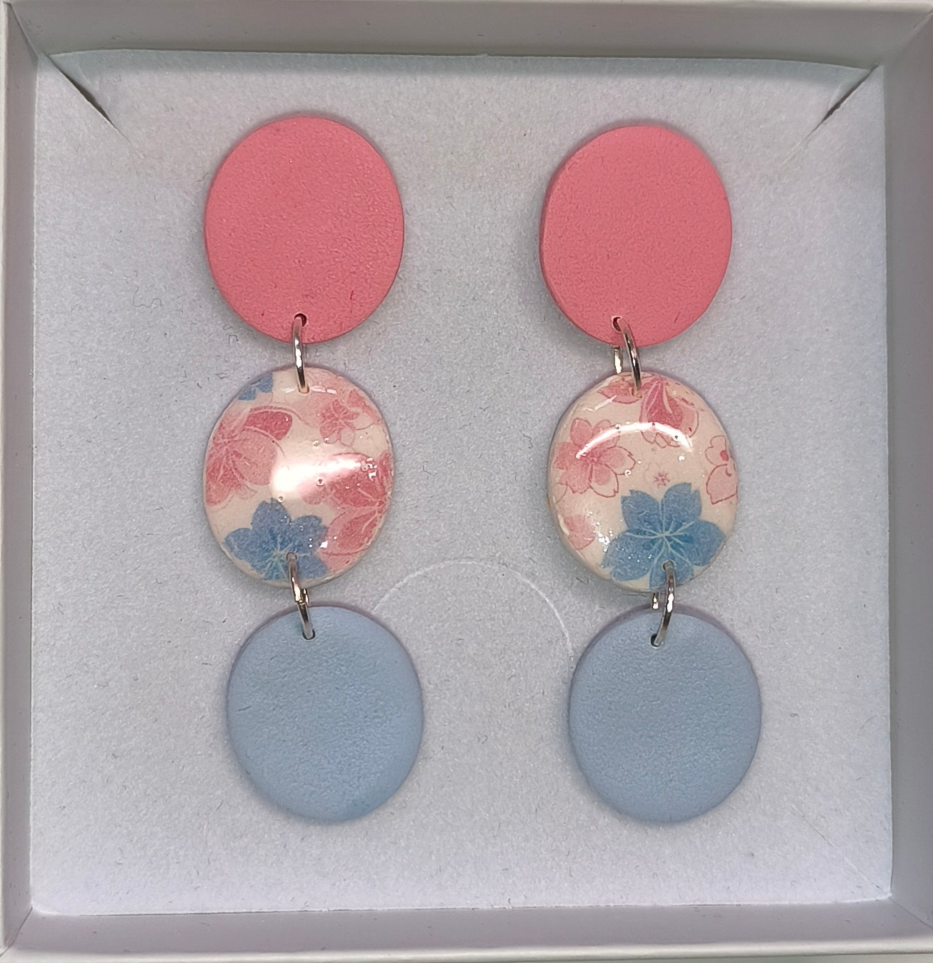 Disco floral rosa-celeste