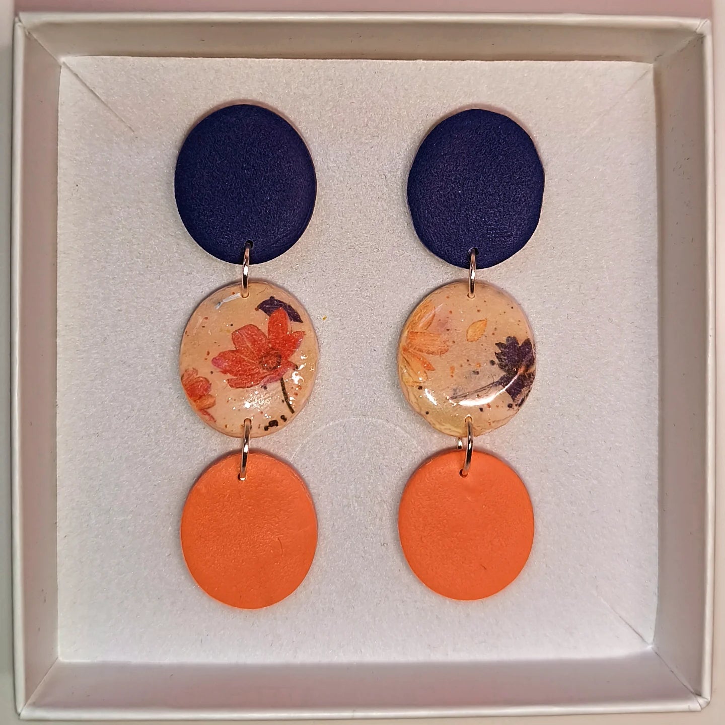 Disco floral azul-naranja
