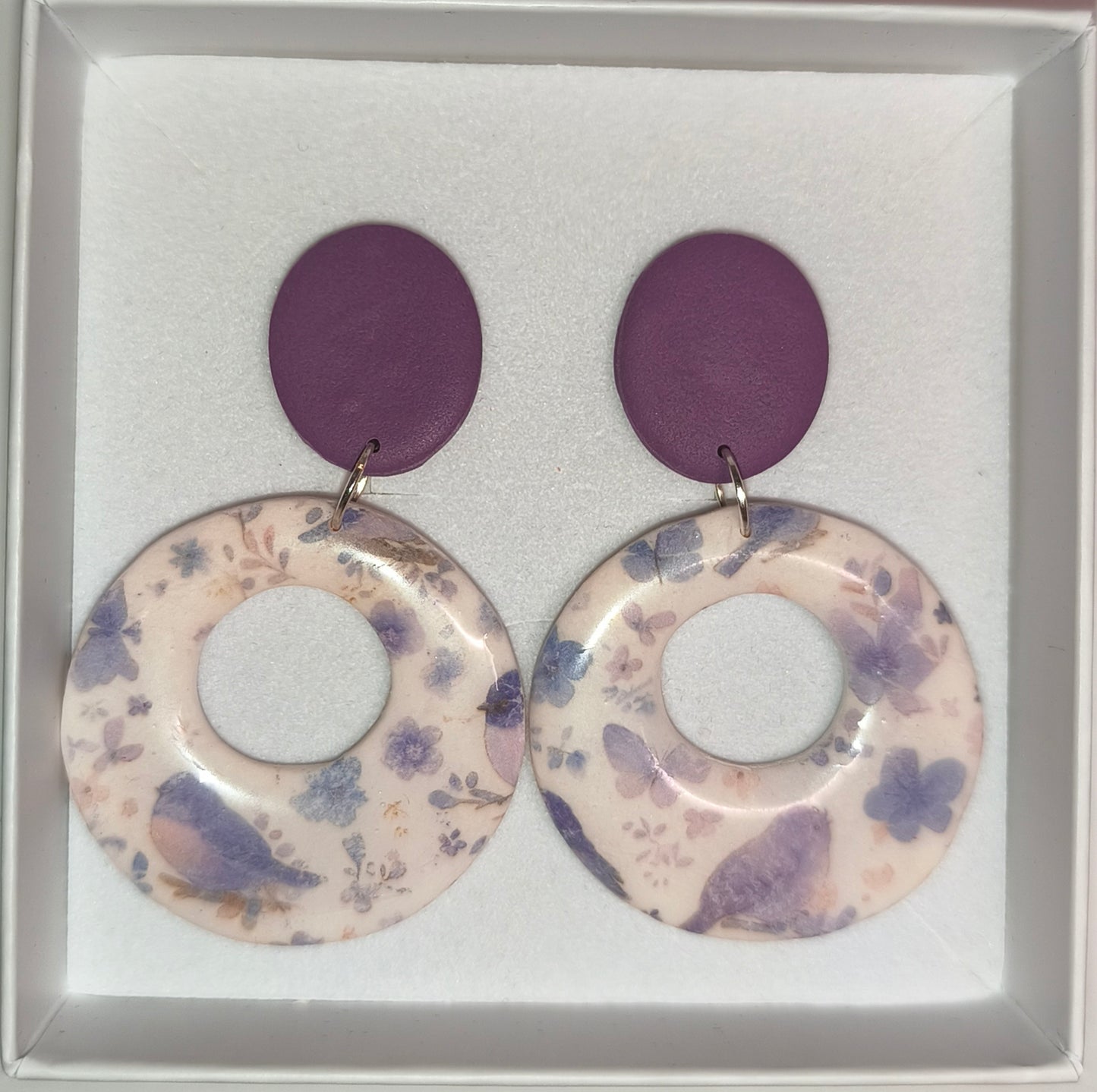 Círculo pájaros morado