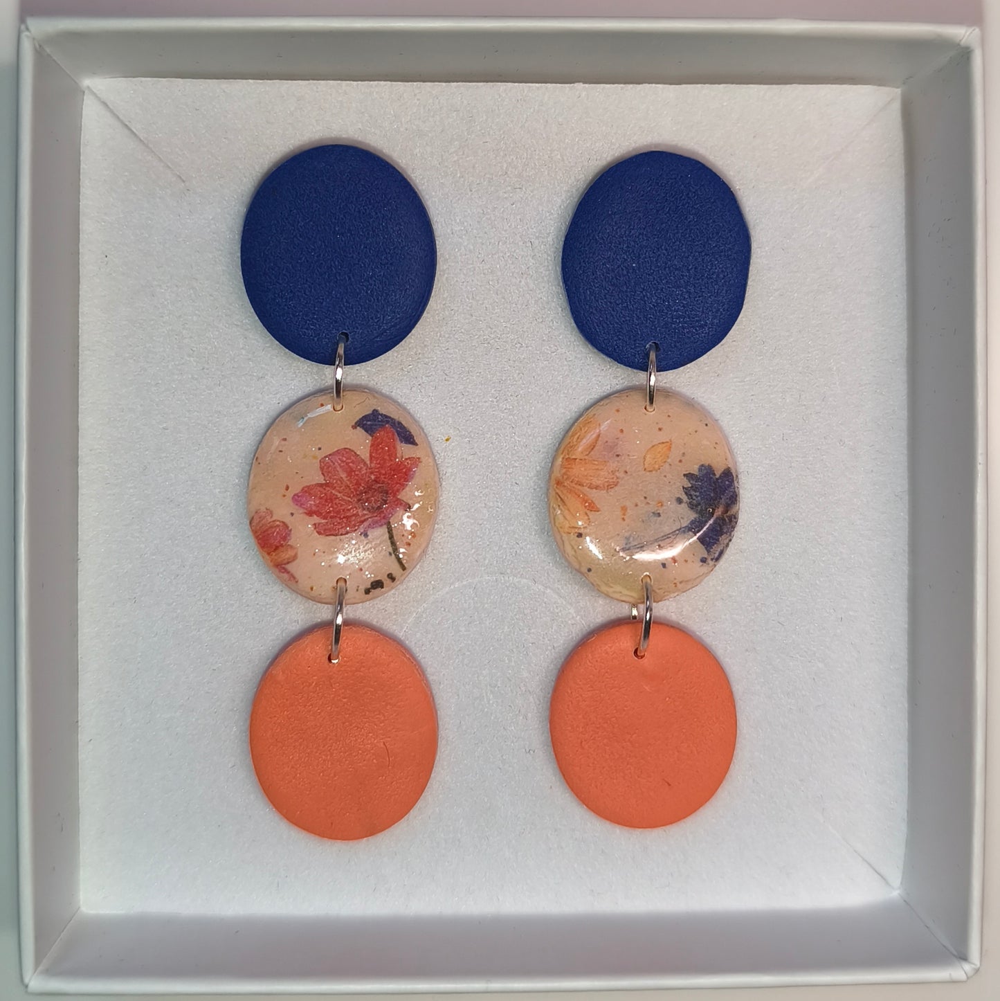 Disco floral azul-naranja